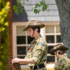 TAS Student Cadet standing in remembrance