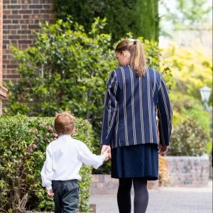 Junior student and Senior student walk hand-in-hand